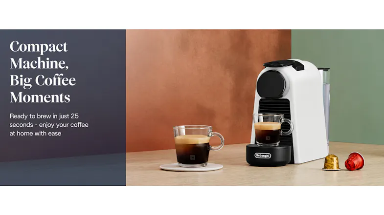 Compact DeLonghi Espresso Machine setup on a counter with espresso cups and colourful capsules Compact DeLonghi Espresso Machine setup on a counter with espresso cups and colourful capsules