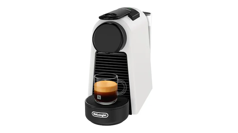 DeLonghi Essenza Mini machine with a clear glass mug of espresso on the drip tray DeLonghi Essenza Mini machine with a clear glass mug of espresso on the drip tray