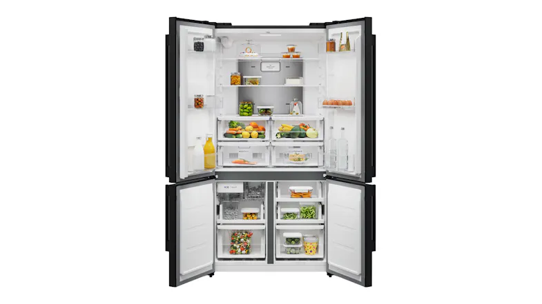 An open four-door refrigerator showcasing filled shelves and drawer compartmen An open four-door refrigerator showcasing filled shelves and drawer compartmen