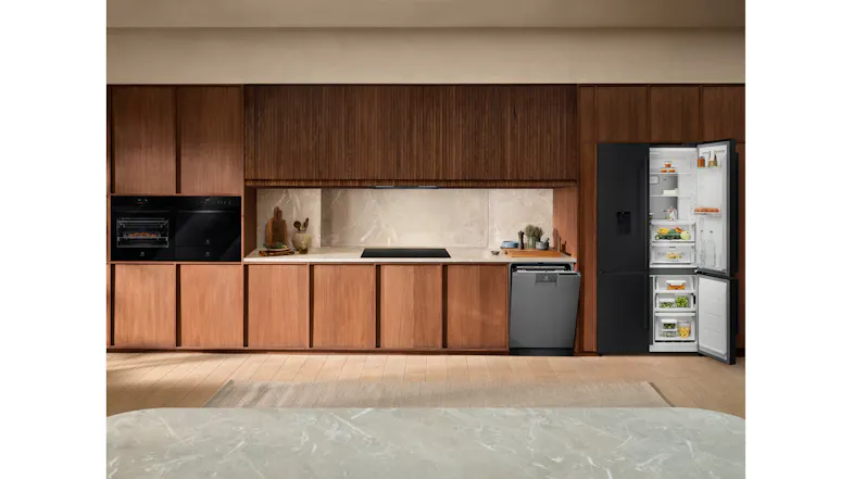 Stylish kitchen showcasing an open refrigerator with wooden cabinetry Stylish kitchen showcasing an open refrigerator with wooden cabinetry