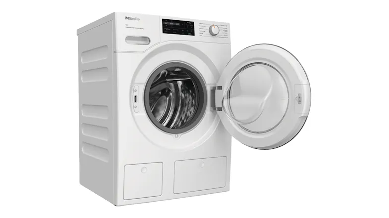 Angled view of the Miele washing machine featuring an open front door Angled view of the Miele washing machine featuring an open front door