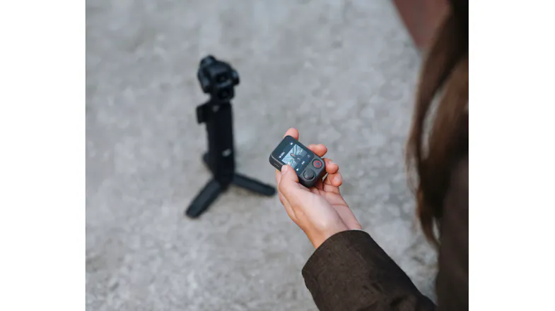 High-angle view of a person using a remote mic with the camera on a tripod High-angle view of a person using a remote mic with the camera on a tripod