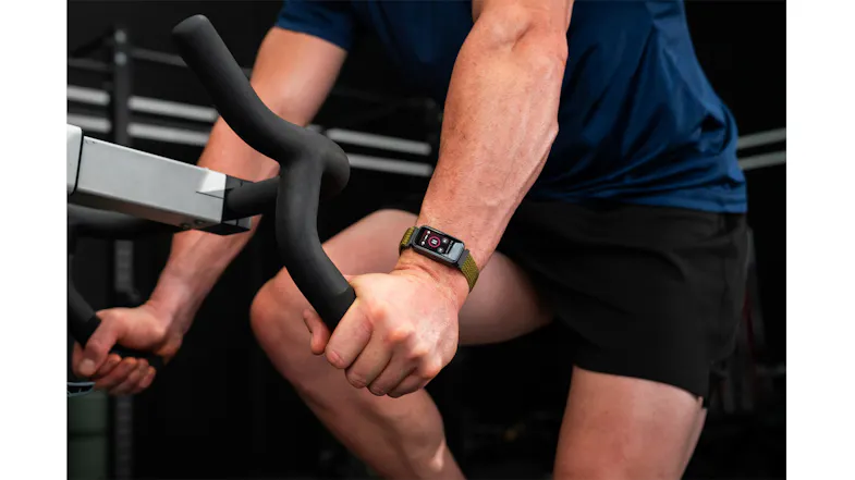 Close-up of a wrist wearing the smartwatch while gripping exercise equipment, highlighting its sporty design Close-up of a wrist wearing the smartwatch while gripping exercise equipment, highlighting its sporty design