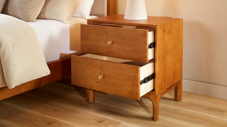 Two-drawer wooden bedside table with open drawers, brass-look handles and tapered legs Two-drawer wooden bedside table with open drawers, brass-look handles and tapered legs