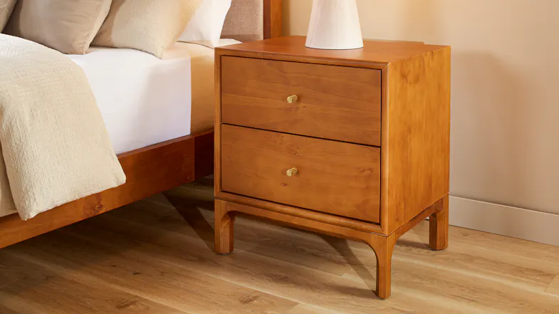 Mid-century wooden bedside table with two drawers, brass-look handles and tapered legs Mid-century wooden bedside table with two drawers, brass-look handles and tapered legs