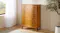 Five-drawer wooden chest with warm finish, brass-look handles and raised legs Five-drawer wooden chest with warm finish, brass-look handles and raised legs