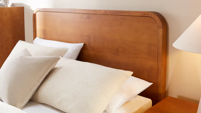 Close-up view of the headboard with rounded corners and smooth finish Close-up view of the headboard with rounded corners and smooth finish