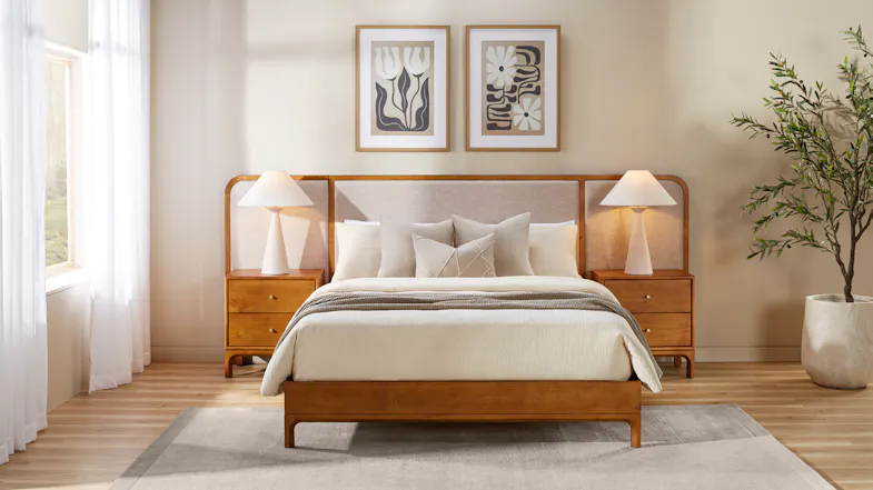 Mid-century wooden bed frame with integrated extended upholstered headboard panels and matching bedside tables Mid-century wooden bed frame with integrated extended upholstered headboard panels and matching bedside tables