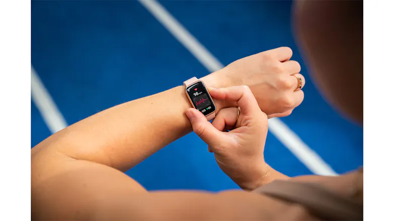 Close-up of a wrist wearing the smartwatch as the user interacts with the touchscreen Close-up of a wrist wearing the smartwatch as the user interacts with the touchscreen