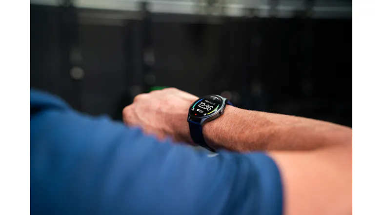 Close-up of the smartwatch worn during exercise, highlighting the round touchscreen display Close-up of the smartwatch worn during exercise, highlighting the round touchscreen display