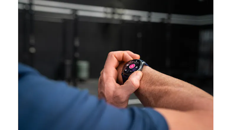 Person interacting with a smartwatch touchscreen during a workout, showing easy navigation of data Person interacting with a smartwatch touchscreen during a workout, showing easy navigation of data