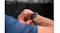 Detailed view of a wrist wearing the smartwatch while adjusting settings on the round display Detailed view of a wrist wearing the smartwatch while adjusting settings on the round display