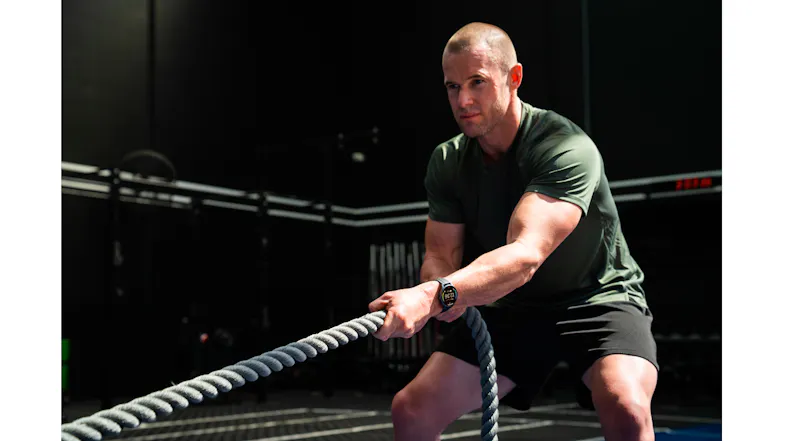 Person performing a battle rope exercise while wearing the Ryze SmartWatch Person performing a battle rope exercise while wearing the Ryze SmartWatch