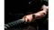 Detailed view of a wrist wearing a smartwatch while gripping battle ropes Detailed view of a wrist wearing a smartwatch while gripping battle ropes