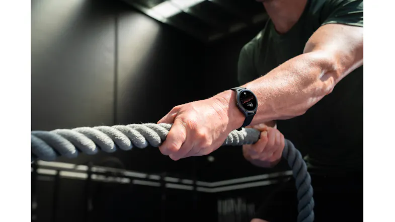 Close-up of the smartwatch on a wrist during a battle rope workout Close-up of the smartwatch on a wrist during a battle rope workout