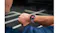Close-up of the smartwatch worn during exercise, showing the round touchscreen display Close-up of the smartwatch worn during exercise, showing the round touchscreen display