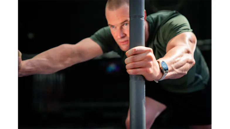 Person exercising with gym equipment while wearing the Ryze Flex (Gen 2) SmartWatch Person exercising with gym equipment while wearing the Ryze Flex (Gen 2) SmartWatch