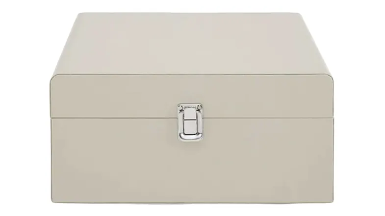 Cream suitcase-style record player with closed lid and silver front latch Cream suitcase-style record player with closed lid and silver front latch