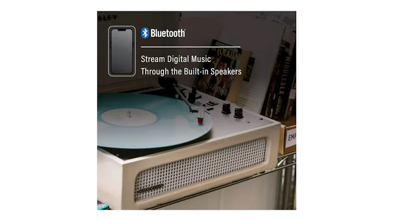Cream Bluetooth record player with built-in speaker grille and blue vinyl record Cream Bluetooth record player with built-in speaker grille and blue vinyl record