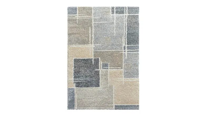 Overhead view of the rug displayed vertically, highlighting the arrangement of beige, grey and charcoal geometric blocks Overhead view of the rug displayed vertically, highlighting the arrangement of beige, grey and charcoal geometric blocks