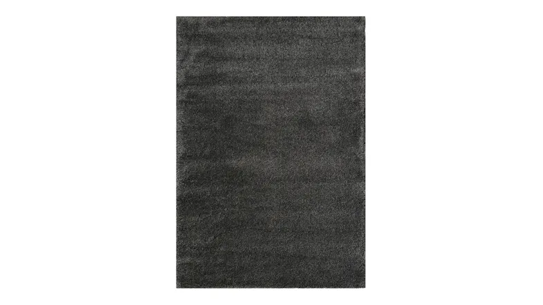 Overhead portrait view of the rug in carbon, highlighting the solid dark colour and soft pile texture Overhead portrait view of the rug in carbon, highlighting the solid dark colour and soft pile texture