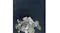 Detailed surface view of the Remi Rug in Navy with a decorative floral arrangement placed on top Detailed surface view of the Remi Rug in Navy with a decorative floral arrangement placed on top