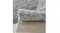 Side view of rug edge with decorative border and precise stitching detail Side view of rug edge with decorative border and precise stitching detail