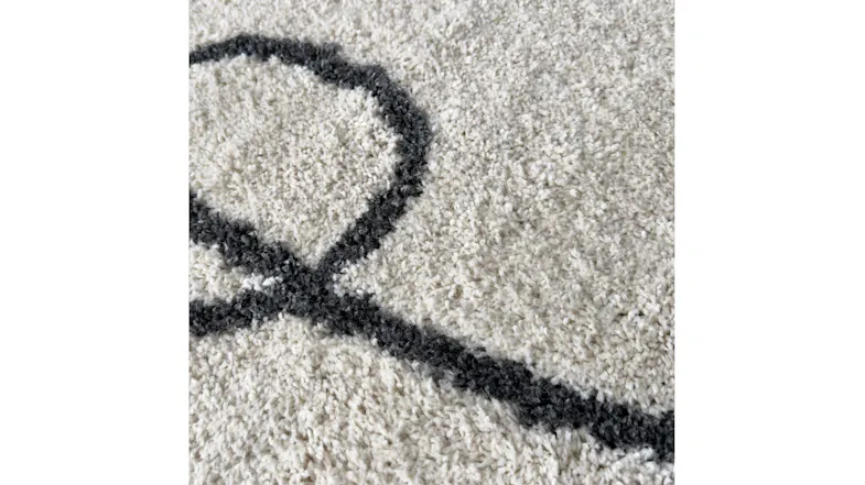 Detailed close-up of rug fibers and weave, emphasising softness and craftsmanship of the sketch design Detailed close-up of rug fibers and weave, emphasising softness and craftsmanship of the sketch design