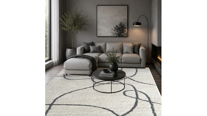 Mercer Sketch Rug placed in a styled living room with sofa, coffee table, and wall art Mercer Sketch Rug placed in a styled living room with sofa, coffee table, and wall art