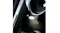 Close-up of a matte black KitchenAid Artisan Plus stand mixer with the integrated bowl light illuminated Close-up of a matte black KitchenAid Artisan Plus stand mixer with the integrated bowl light illuminated