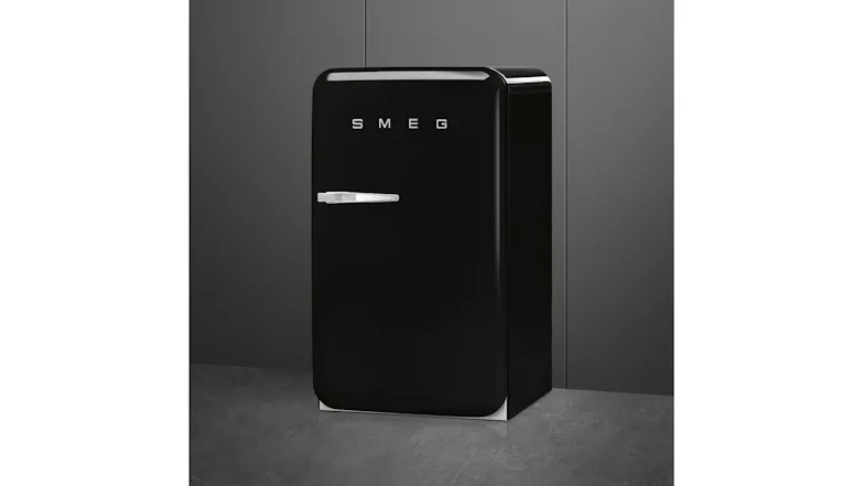 Front right view of a black SMEG mini refrigerator with a retro curved design and chrome handle Front right view of a black SMEG mini refrigerator with a retro curved design and chrome handle