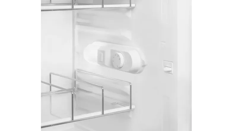 Close-up view of a SMEG minibar refrigerator thermostat control and interior storage rack in a white finish Close-up view of a SMEG minibar refrigerator thermostat control and interior storage rack in a white finish