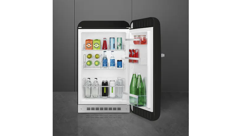 Front view of a black SMEG minibar fridge with the door open, showing stocked shelves and beverage storage Front view of a black SMEG minibar fridge with the door open, showing stocked shelves and beverage storage