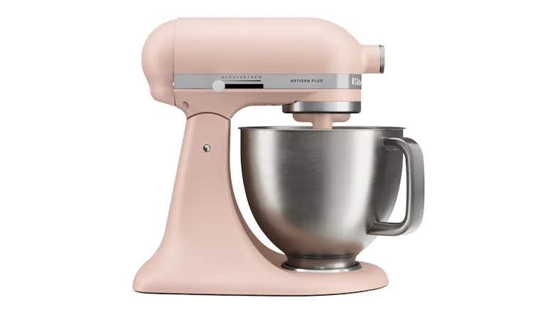 Side view of the Feathered Pink White KitchenAid Artisan Plus stand mixer with a stainless steel mixing bowl Side view of the Feathered Pink White KitchenAid Artisan Plus stand mixer with a stainless steel mixing bowl