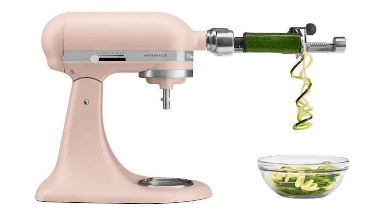 Side view of the KitchenAid Artisan Plus stand mixer with a spiraliser attachment and zucchini noodles Side view of the KitchenAid Artisan Plus stand mixer with a spiraliser attachment and zucchini noodles