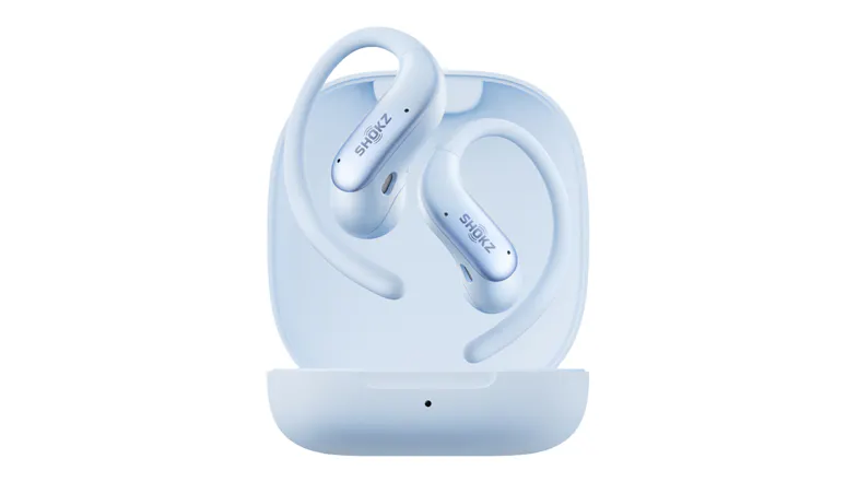 Front angled view of ice blue Shokz open-ear wireless earbuds displayed in an open charging case Front angled view of ice blue Shokz open-ear wireless earbuds displayed in an open charging case