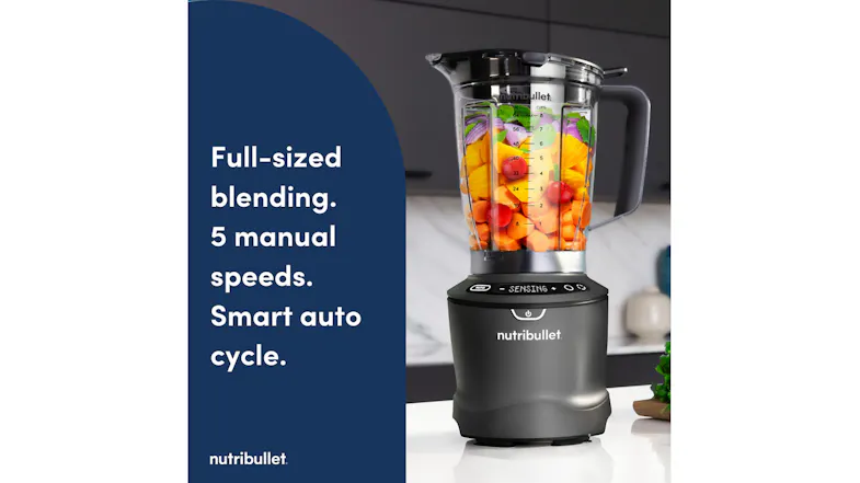 Nutribullet full-sized blender combo featuring a grey motor base and a clear plastic pitcher filled with fresh fruit Nutribullet full-sized blender combo featuring a grey motor base and a clear plastic pitcher filled with fresh fruit
