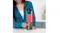 Woman pressing the power button on a gunmetal grey Nutribullet portable blender filled with a pink smoothie on a countertop Woman pressing the power button on a gunmetal grey Nutribullet portable blender filled with a pink smoothie on a countertop