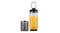 Nutribullet portable blender cup filled with orange juice and fitted with a carrying loop lid, positioned next to its detached gunmetal grey motor base Nutribullet portable blender cup filled with orange juice and fitted with a carrying loop lid, positioned next to its detached gunmetal grey motor base
