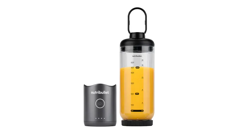 Nutribullet portable blender cup filled with orange juice and fitted with a carrying loop lid, positioned next to its detached gunmetal grey motor base Nutribullet portable blender cup filled with orange juice and fitted with a carrying loop lid, positioned next to its detached gunmetal grey motor base