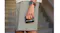 Shark portable cooling device held by a person wearing grey shorts, featuring a charcoal cylindrical body and visible Shark branding Shark portable cooling device held by a person wearing grey shorts, featuring a charcoal cylindrical body and visible Shark branding