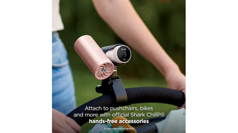 Rose gold Shark ChillPill personal cooling fan mounted on a stroller handlebar with a clamp accessory and digital display Rose gold Shark ChillPill personal cooling fan mounted on a stroller handlebar with a clamp accessory and digital display
