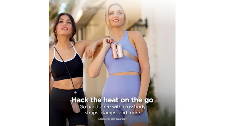 Two people wearing activewear using the rose gold Shark ChillPill cooling devices with a crossbody strap and neck lanyard. Two people wearing activewear using the rose gold Shark ChillPill cooling devices with a crossbody strap and neck lanyard.