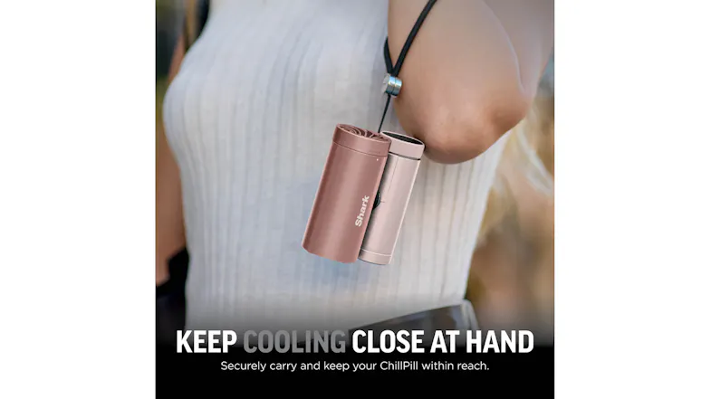 Rose gold and pink Shark ChillPill cooling devices hanging from a black adjustable wrist lanyard worn by a person Rose gold and pink Shark ChillPill cooling devices hanging from a black adjustable wrist lanyard worn by a person