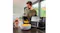 Kitchen scene featuring a Braun black dual-drawer air fryer and a removable basket filled with fries Kitchen scene featuring a Braun black dual-drawer air fryer and a removable basket filled with fries