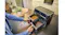 Top-angled view of a Braun black dual-drawer air fryer with open baskets holding fries and grilled steak Top-angled view of a Braun black dual-drawer air fryer with open baskets holding fries and grilled steak