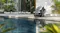 Lifestyle image of the Aiper Scuba X1 Pro Max beside a modern swimming pool Lifestyle image of the Aiper Scuba X1 Pro Max beside a modern swimming pool