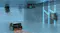 Underwater scene showing the pool cleaner cleaning the pool floor while another unit climbs a wall Underwater scene showing the pool cleaner cleaning the pool floor while another unit climbs a wall