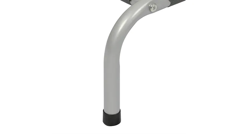 Close-up of silver steel pet bed leg with black non-slip foot cap Close-up of silver steel pet bed leg with black non-slip foot cap