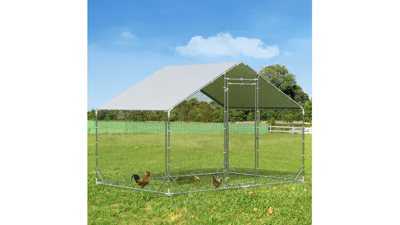 Front angle view of a grey PaWz metal chicken coop with a covered roof and wire mesh enclosure on a lawn Front angle view of a grey PaWz metal chicken coop with a covered roof and wire mesh enclosure on a lawn